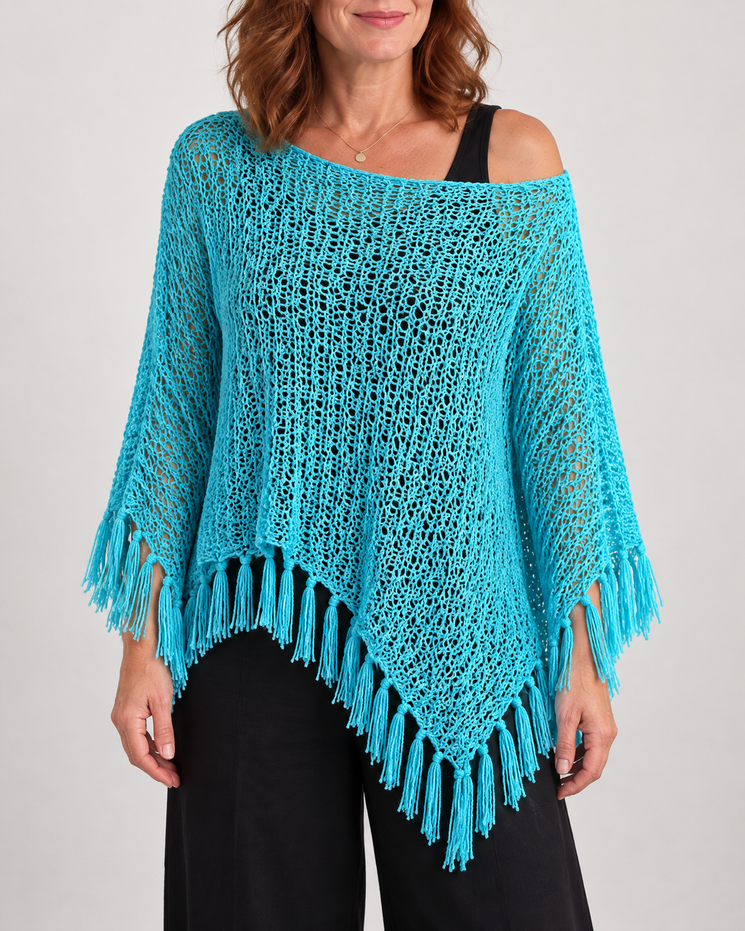 Oceane - Open Knit Tassel Poncho in turquoise, front view