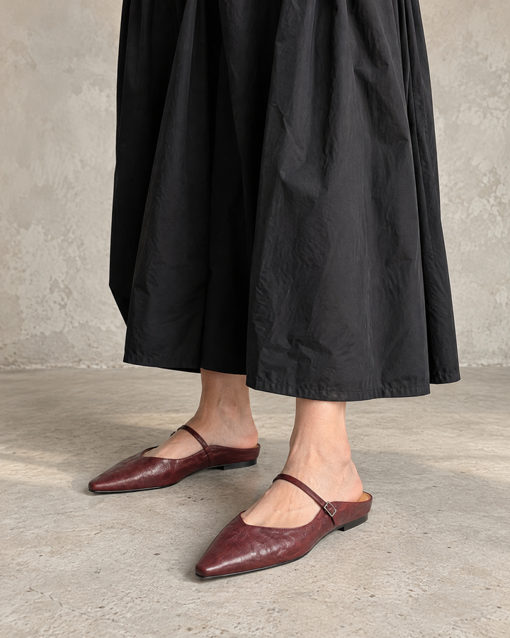 Felicie - Leather Mary Jane Mules in burgundy, front view, with a black maxi dress