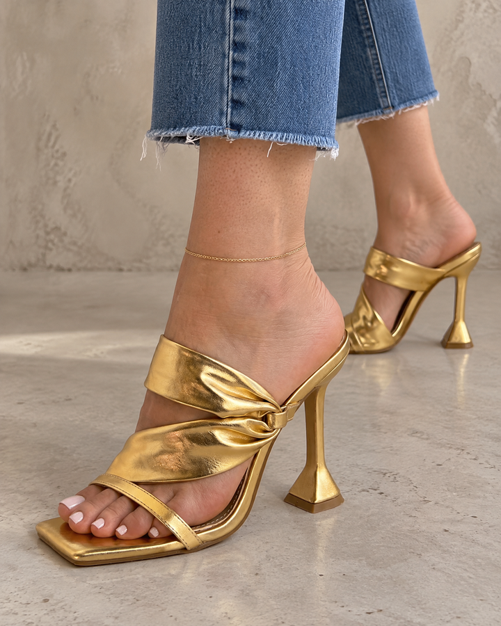 Liane - Twist Strap Mule Heels in gold, side view