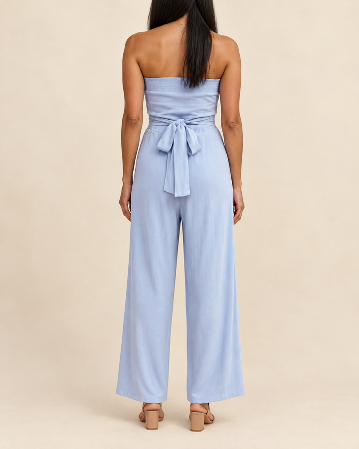 Lisette - Strapless Tie Waist Jumpsuit in sky blue, back view
