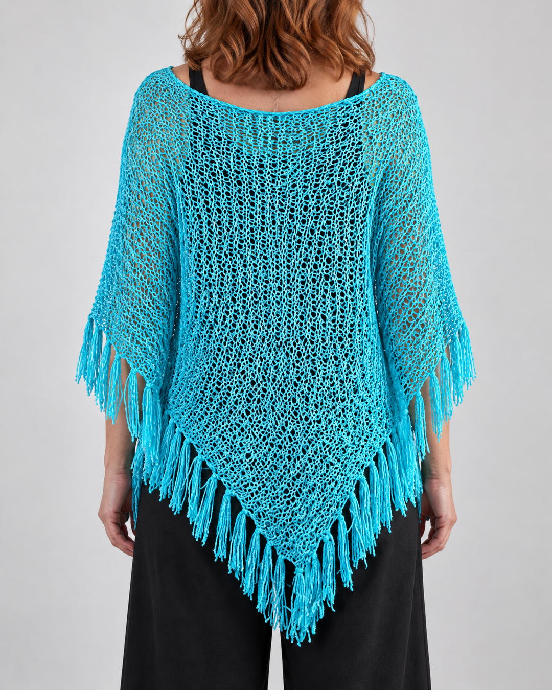 Oceane - Open Knit Tassel Poncho in turquoise, back view