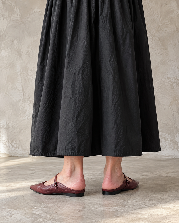 Felicie - Leather Mary Jane Mules in burgundy, back view, with a black maxi dress