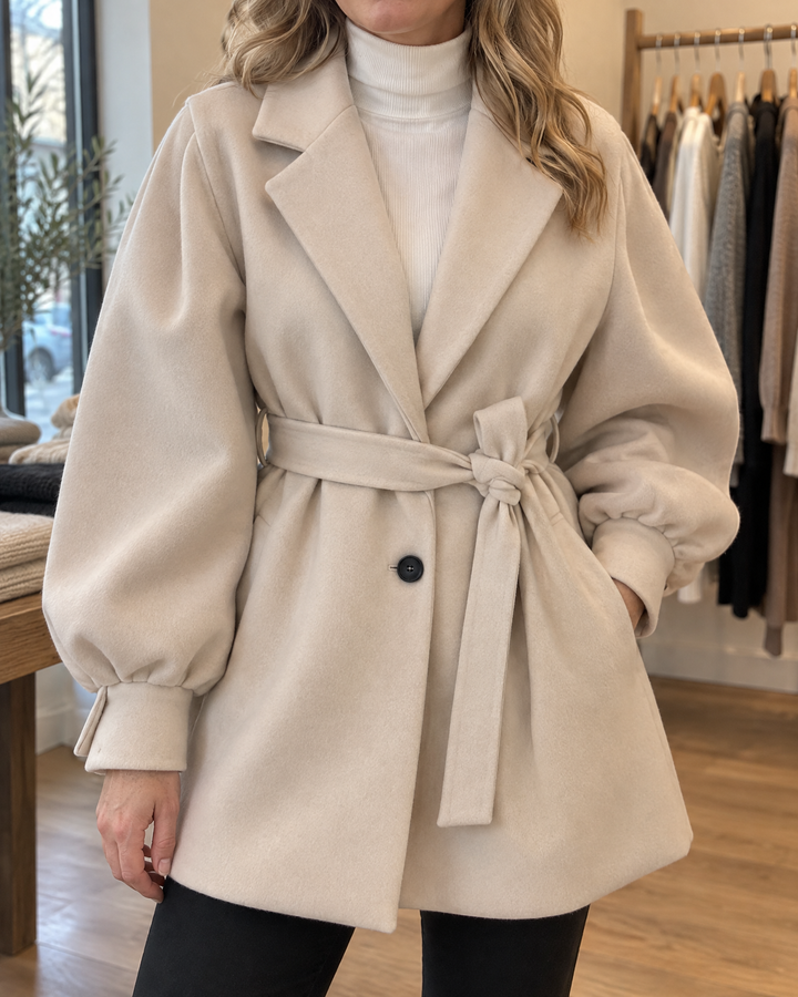 Martine - Balloon Sleeve Belted Coat in cream, detail of the balloon sleeve, the cuff and the tie belt