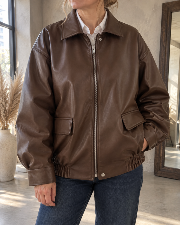 Leontine - Oversized Faux Leather Bomber in brown, detail of the collar, the zip and the flap pocket