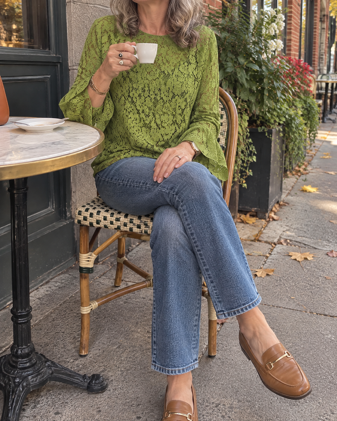 Violette - Lace Long Sleeve Top in green, on a café terrace