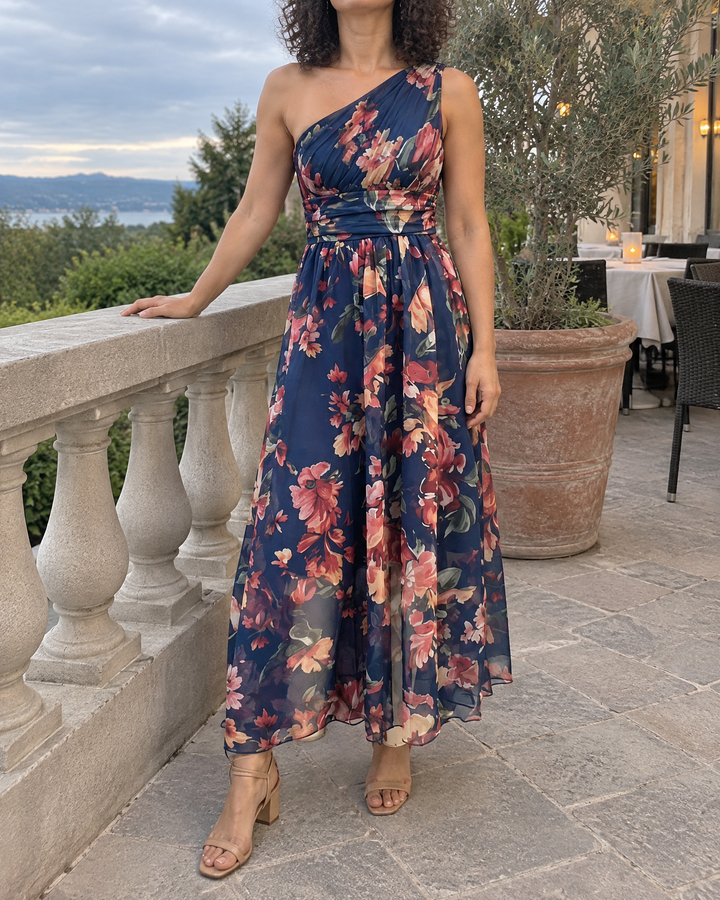 Giselle - One-Shoulder Floral Maxi Dress in navy, on a restaurant terrace
