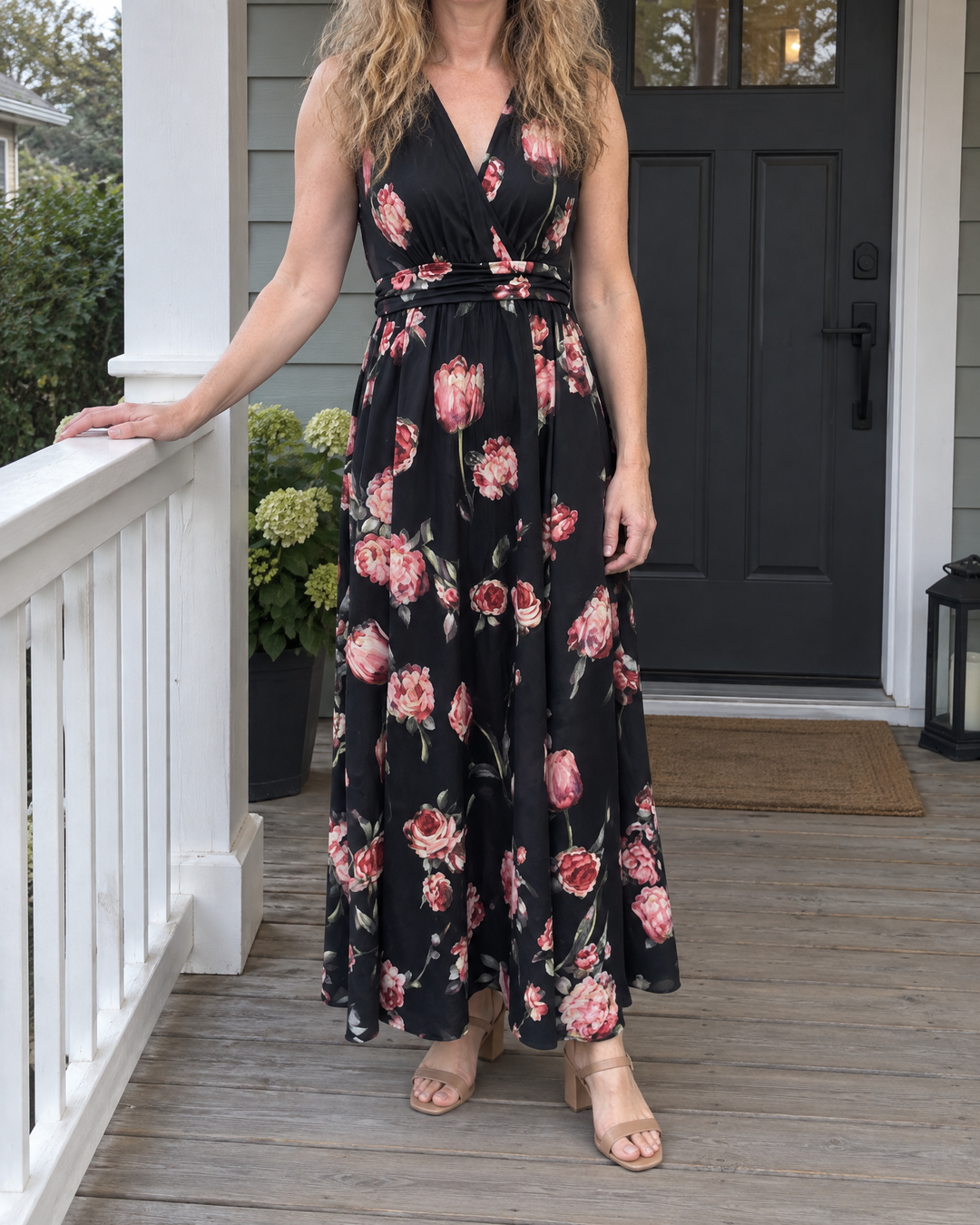 Amelie - V-Neck Floral Maxi Dress in black, on a porch