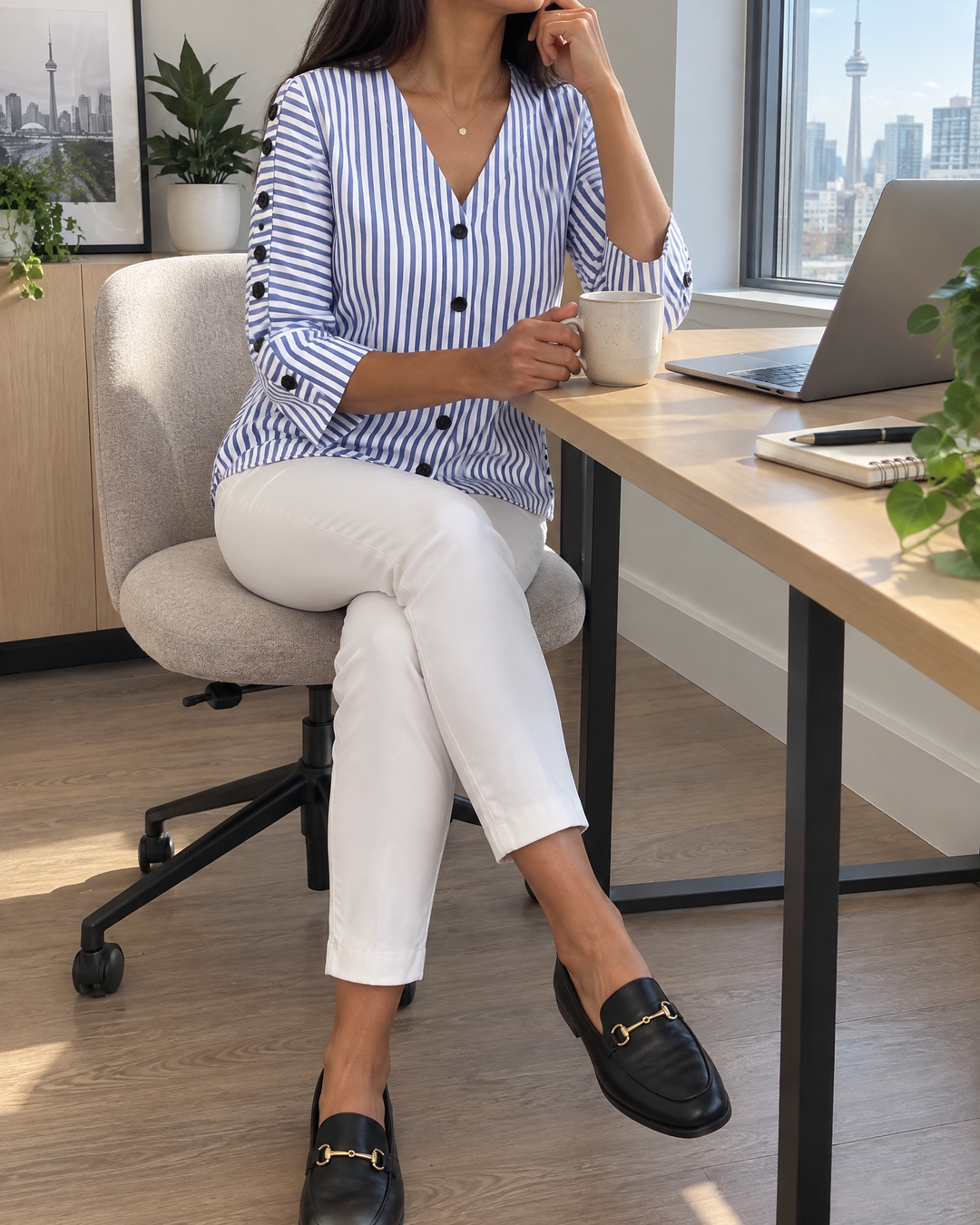 Simone - Button Sleeve Blouse in navy stripe, worn at a desk