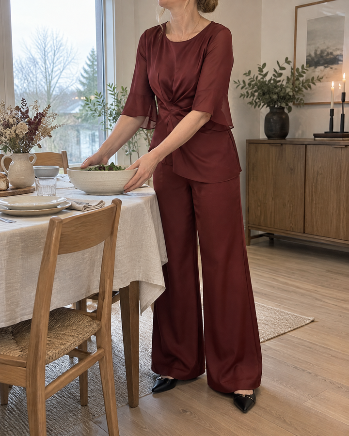 Lorraine - Satin Flared-Sleeve Set in wine, setting the table for a family dinner
