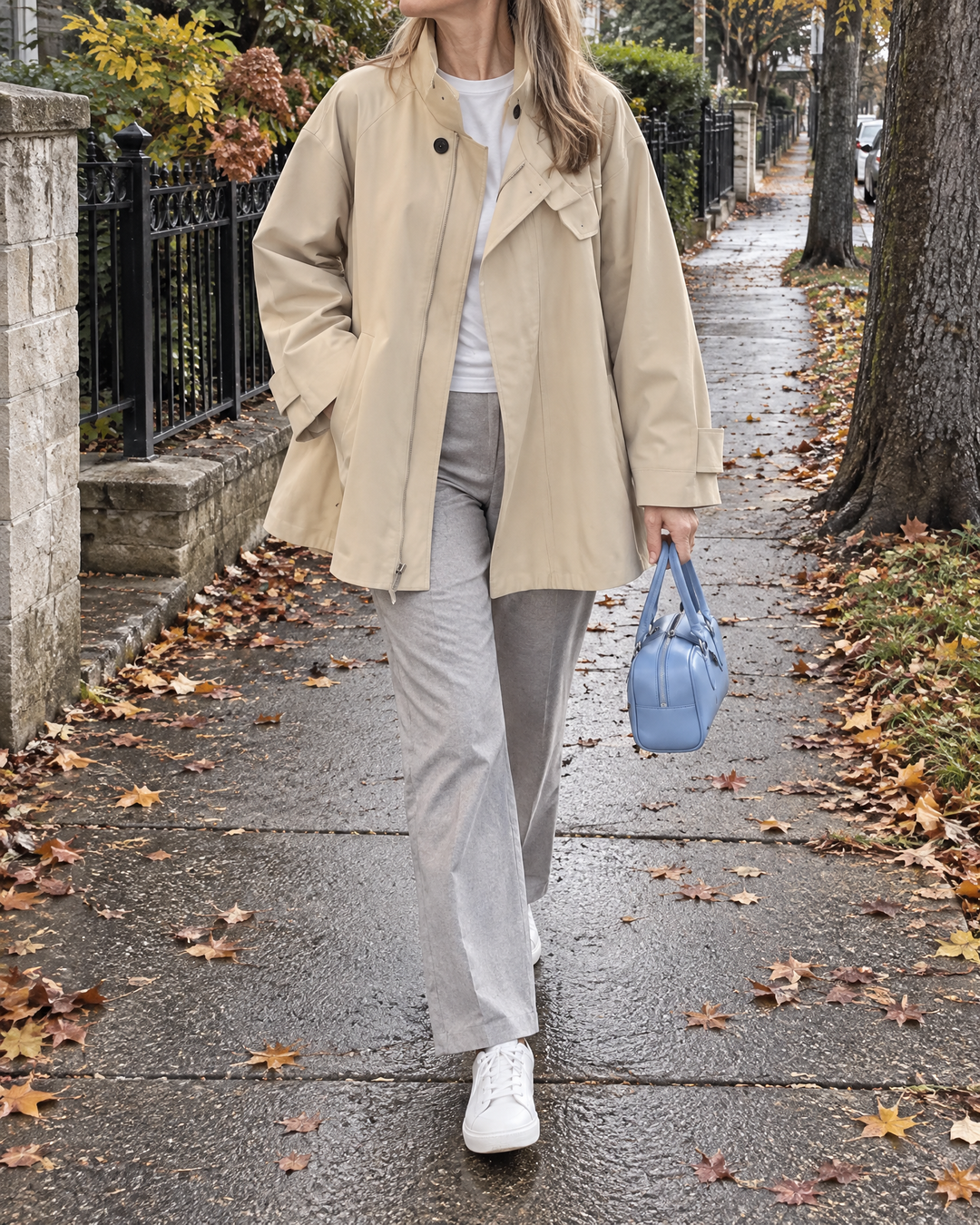 Michelle - Stand Collar Trench Jacket in light khaki, on a walk on a grey fall afternoon