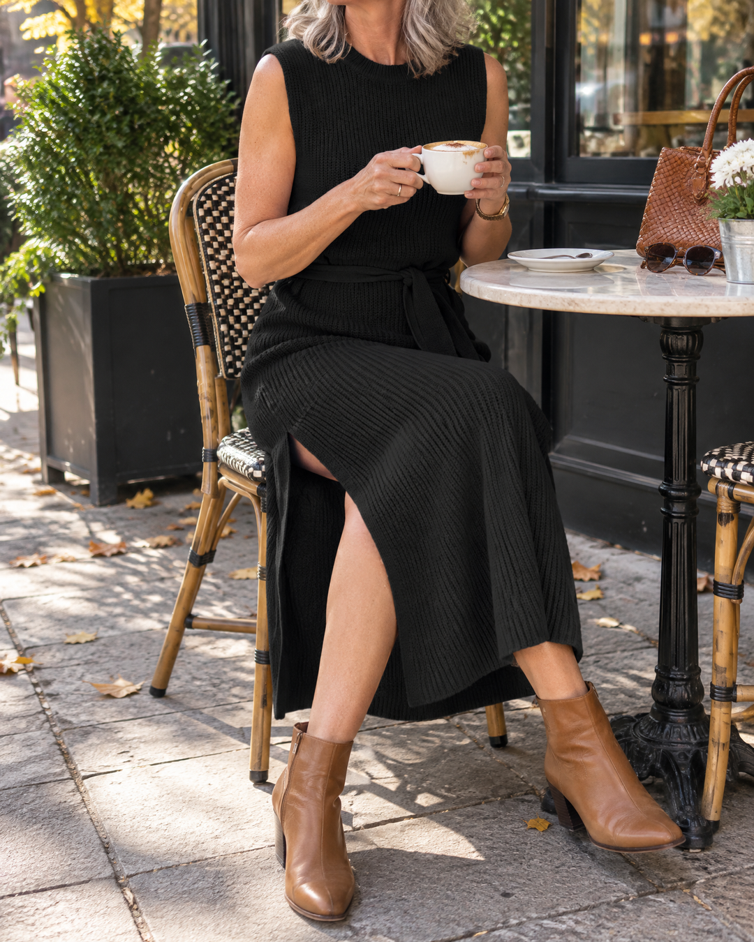 Lucile - Sleeveless Knit Midi Dress in black, on a café terrace