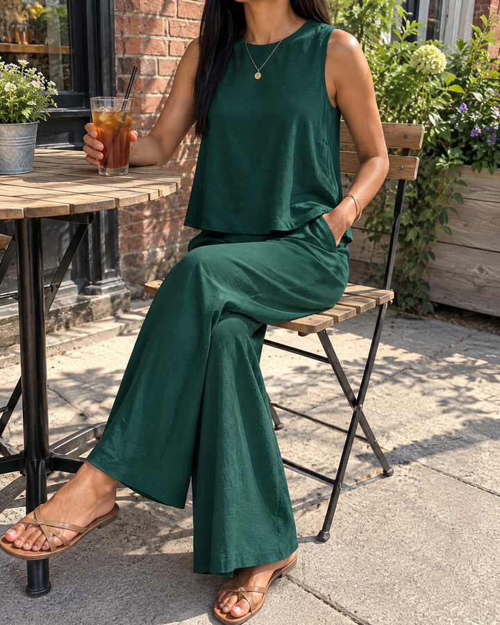 Noelle - Sleeveless Top and Wide Leg Pants Set in dark green, on a patio