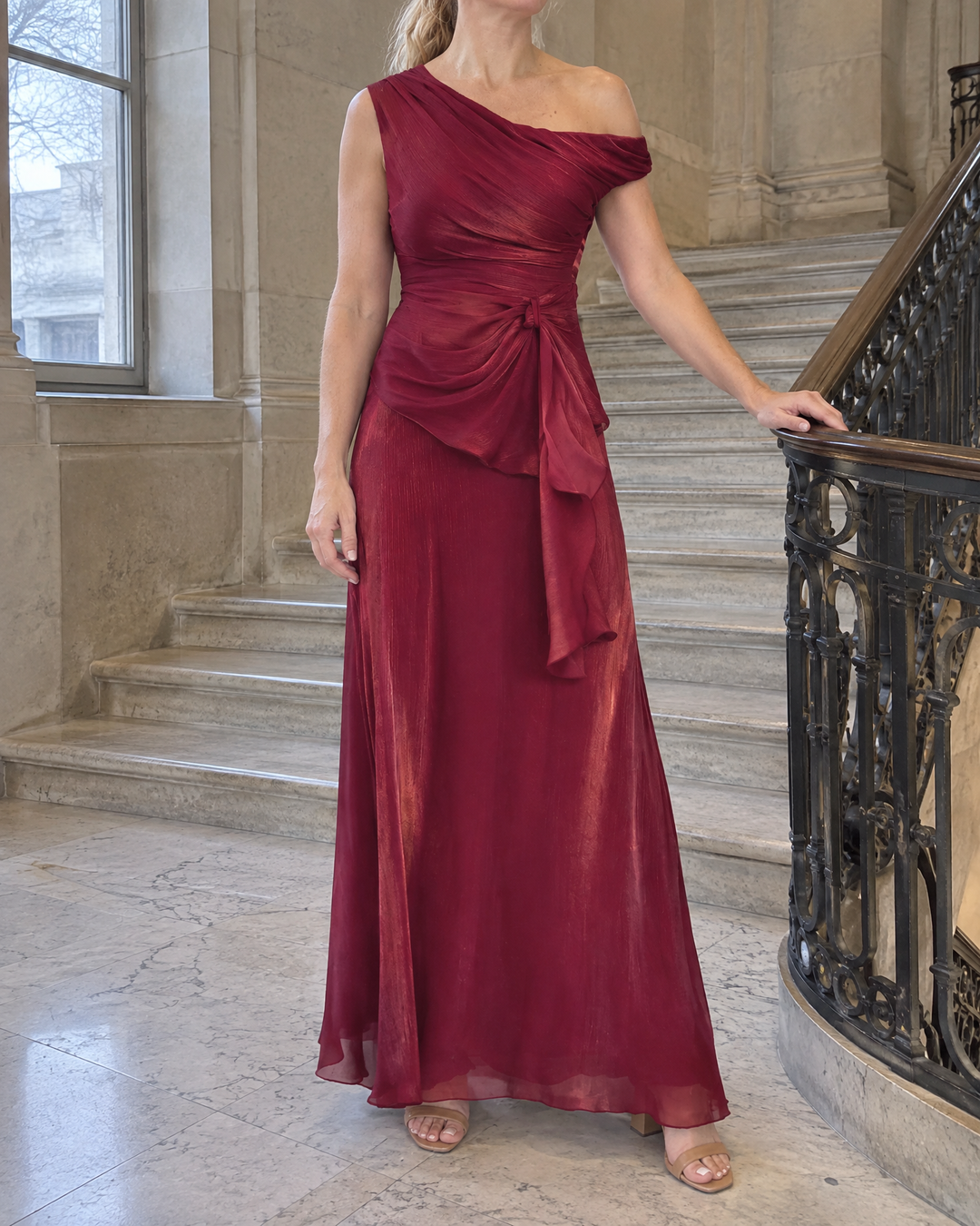 Salome - Draped One-Shoulder Maxi Set in wine, on a stone staircase