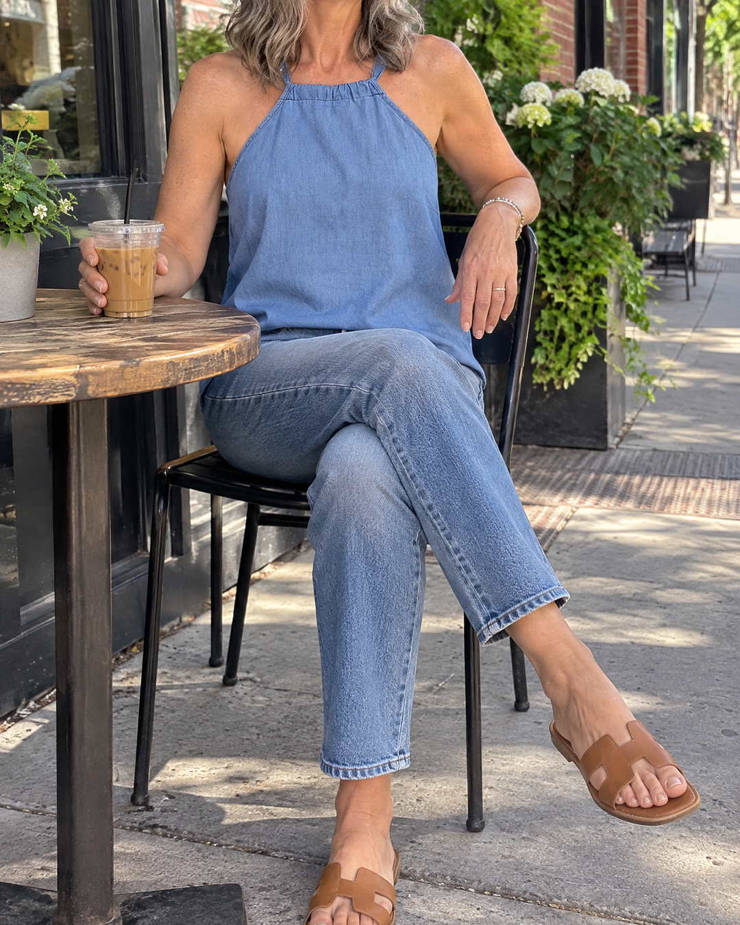 Oriane - Halter Tank Top in chambray blue, on a patio