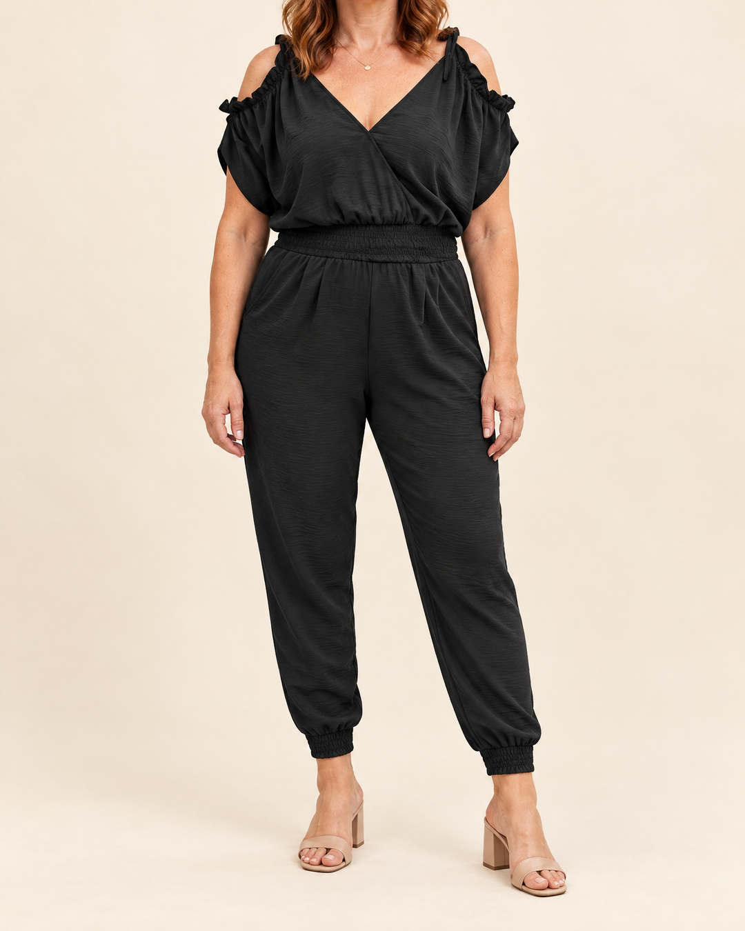 Perrine - Wrap Jogger Jumpsuit in black, front view