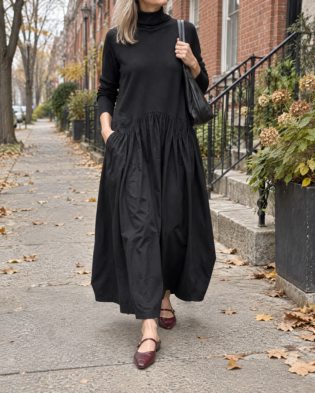 Felicie - Leather Mary Jane Mules in burgundy, with a black maxi dress on a quiet street