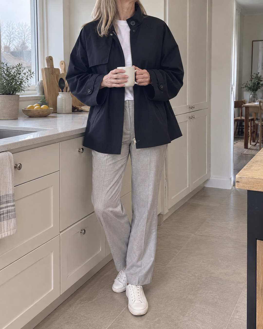 Michelle - Stand Collar Trench Jacket in black, at home on a grey morning
