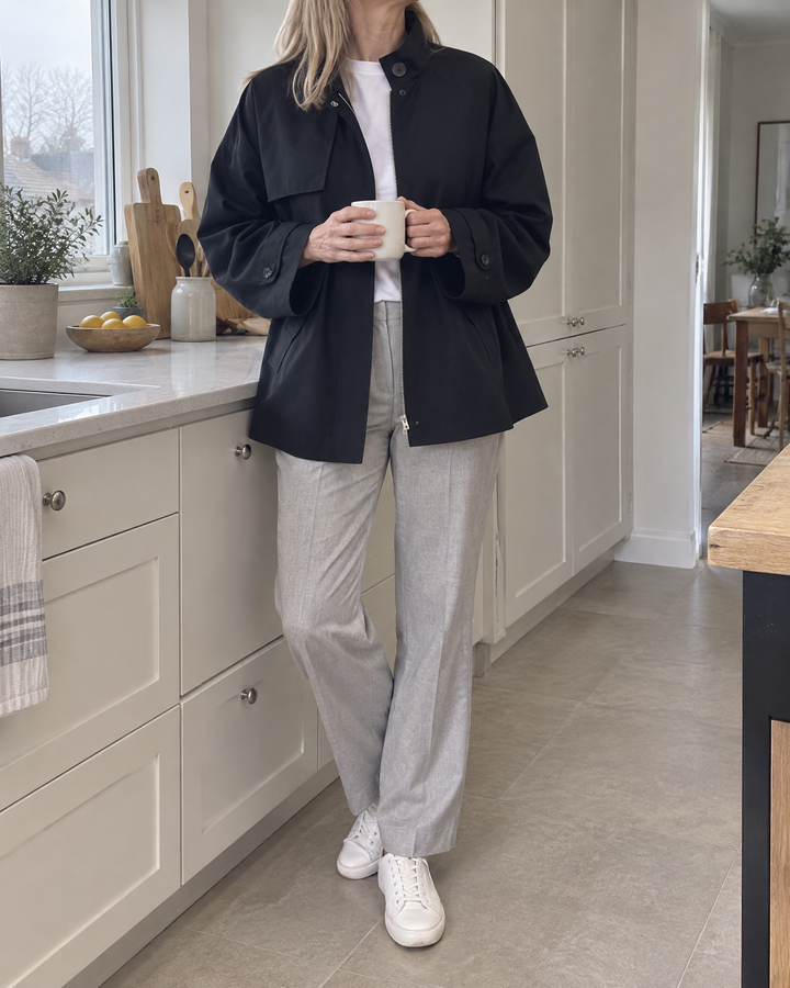 Michelle - Stand Collar Trench Jacket in black, at home on a grey morning