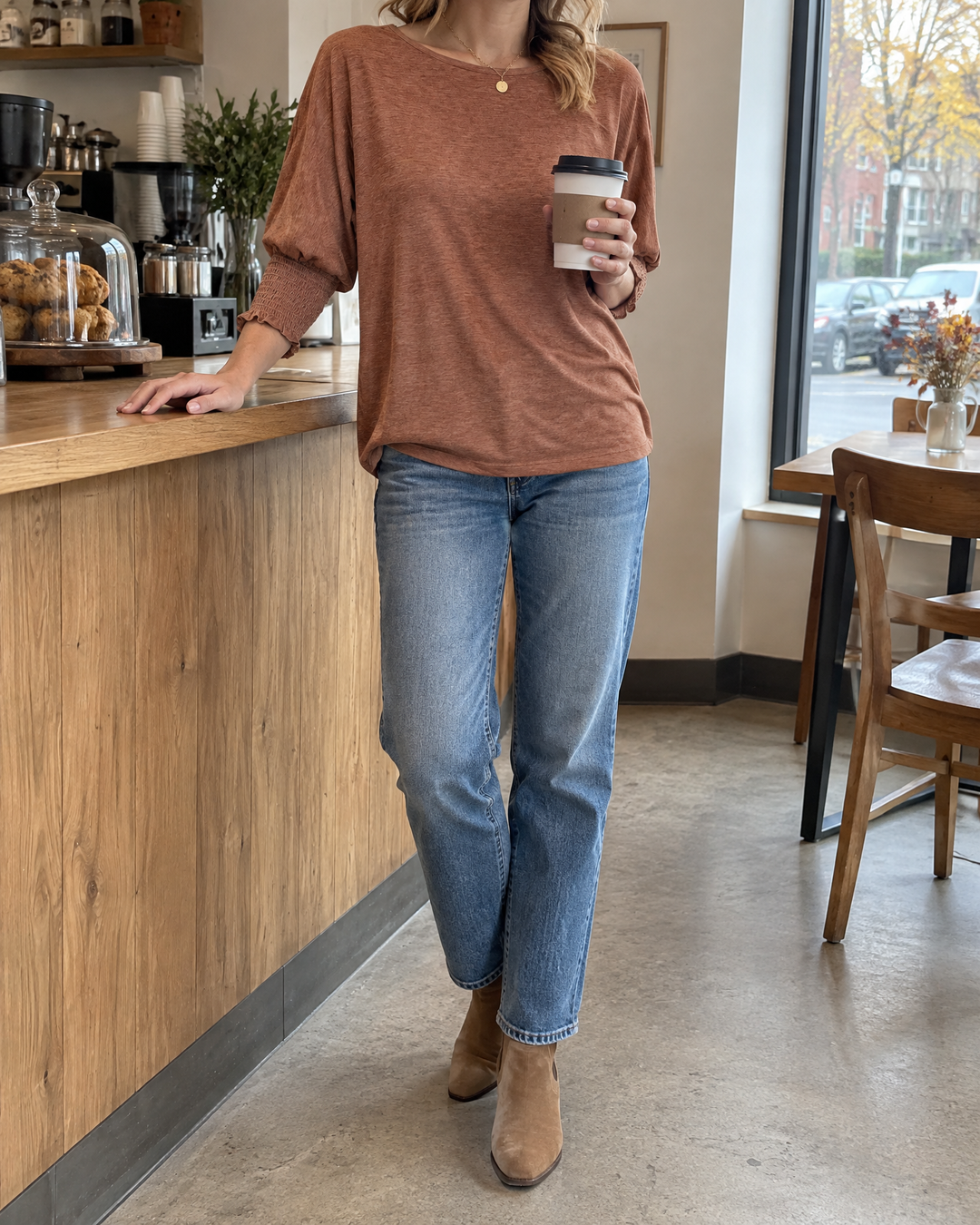 Laurence - Smocked Cuff Top in caramel, at the neighbourhood café on a Saturday morning