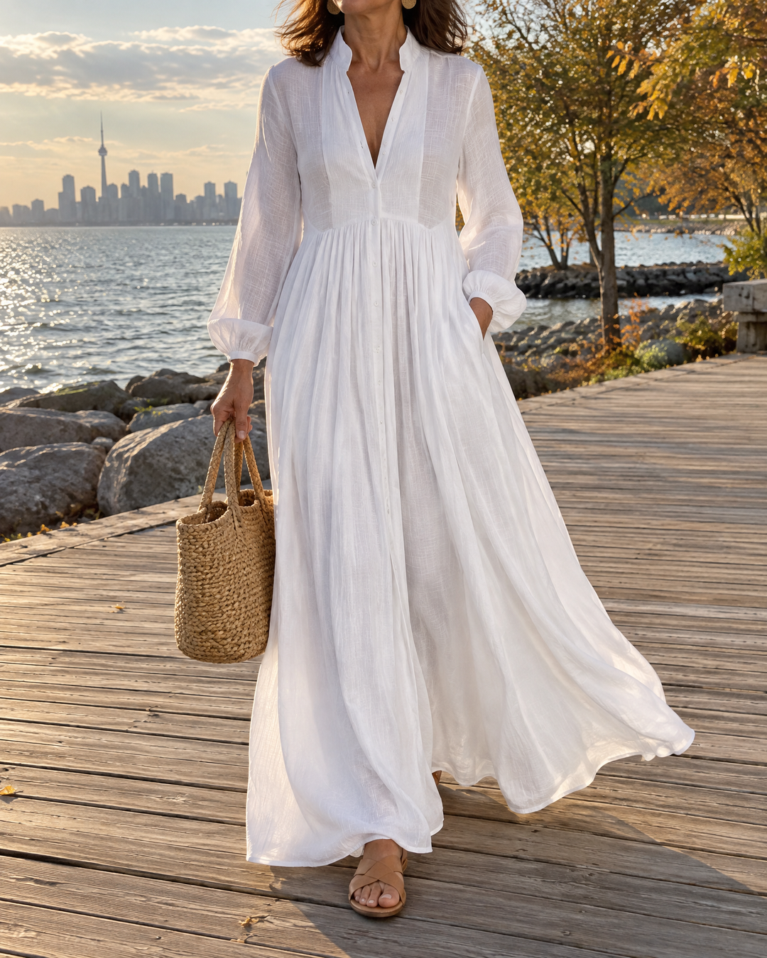 Colette - Button-Front Maxi Dress in white, worn on a lakeside boardwalk