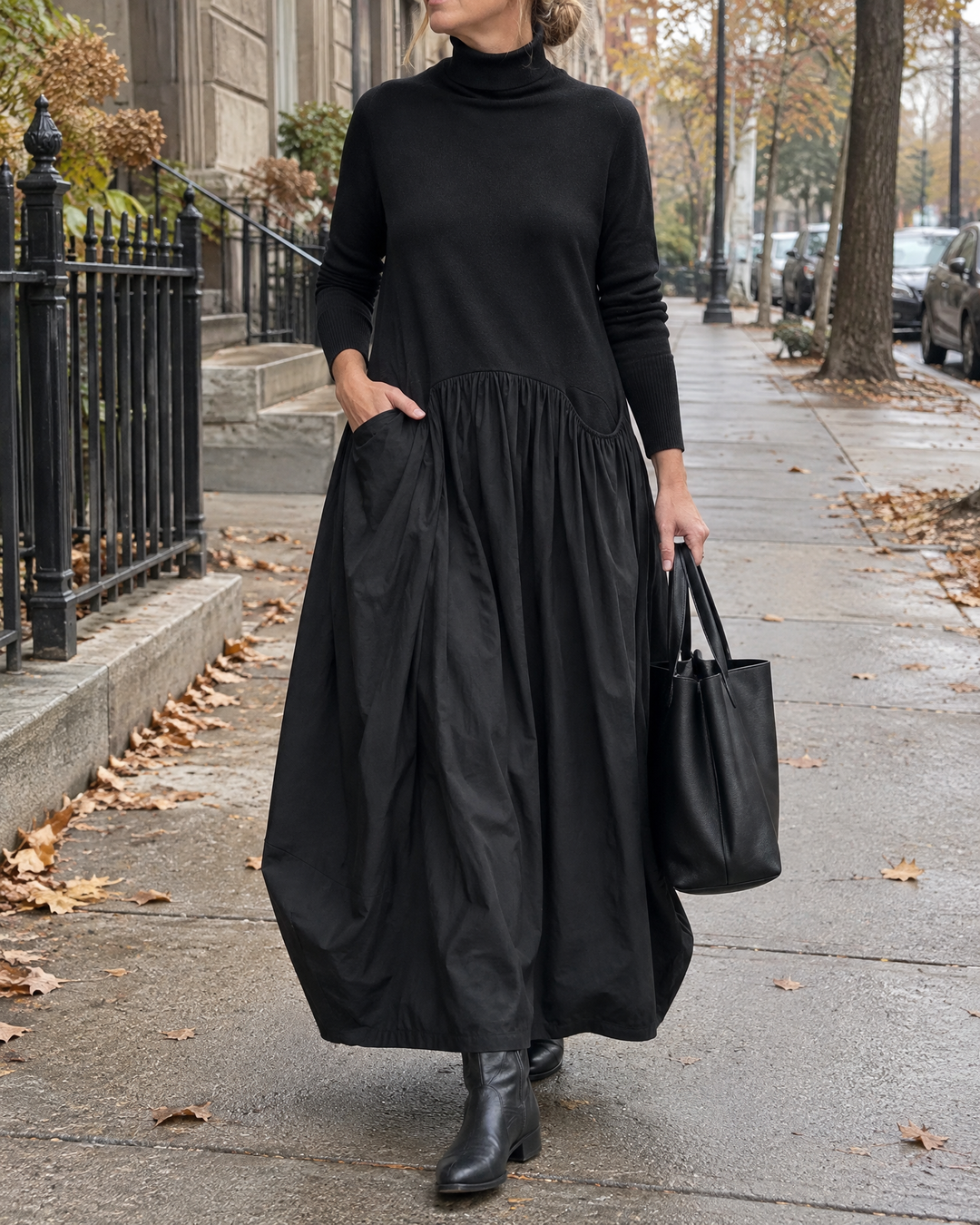 Odette - Turtleneck Maxi Dress in black, on a quiet city street on an overcast morning
