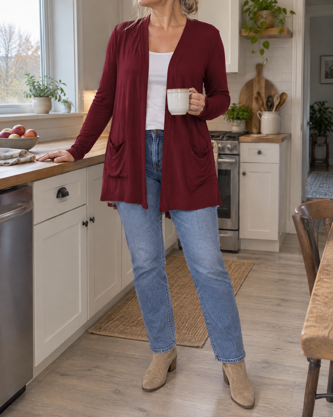 Nicolette - Longline Pocket Cardigan in wine, in the kitchen on a grey morning