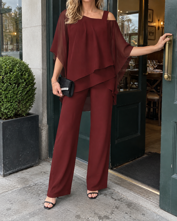 Isaure - Batwing Asymmetric Set in burgundy, arriving for a family lunch