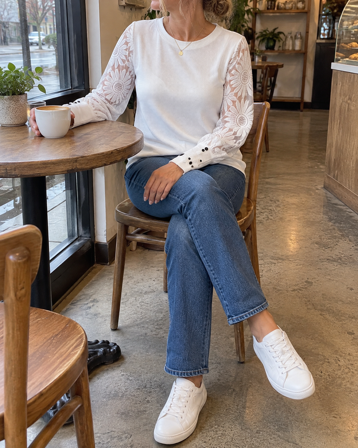 Laurine - Lace Sleeve Waffle Top in white, at a café table by the window