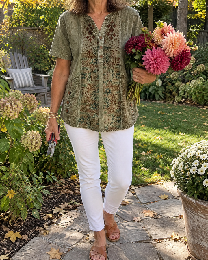 Ottilie - Art Print Henley Top in olive, worn in a garden
