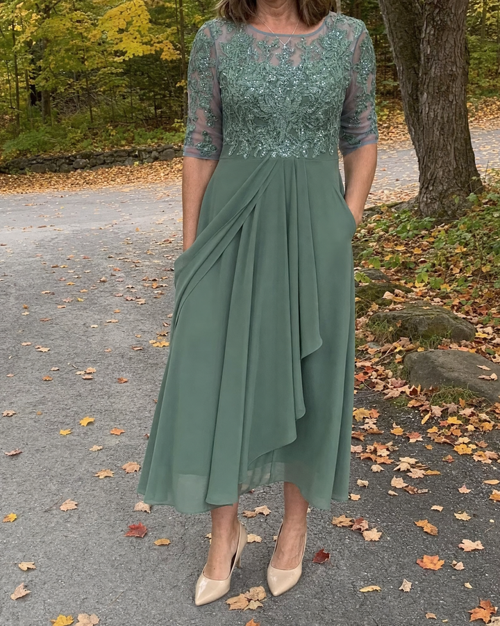 Odette - Elegant Dress in green, worn on an autumn path