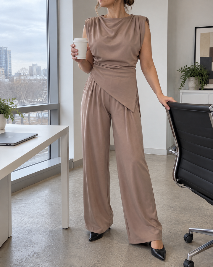 Jeanne - Asymmetric Sleeveless Set in taupe, at the office on a grey morning