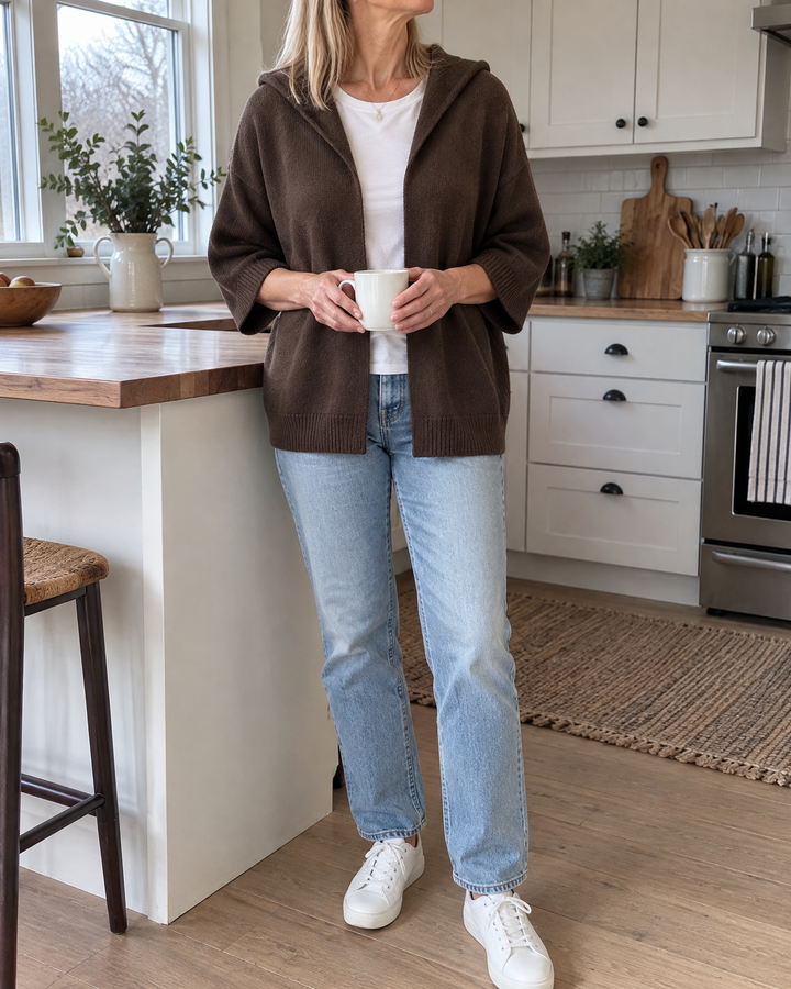 Viviane - Hooded Open-Front Cardigan in chocolate, in her kitchen on an overcast morning