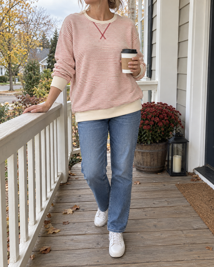 Charlotte - Fine Stripe Pullover in red, on the porch on a mild afternoon