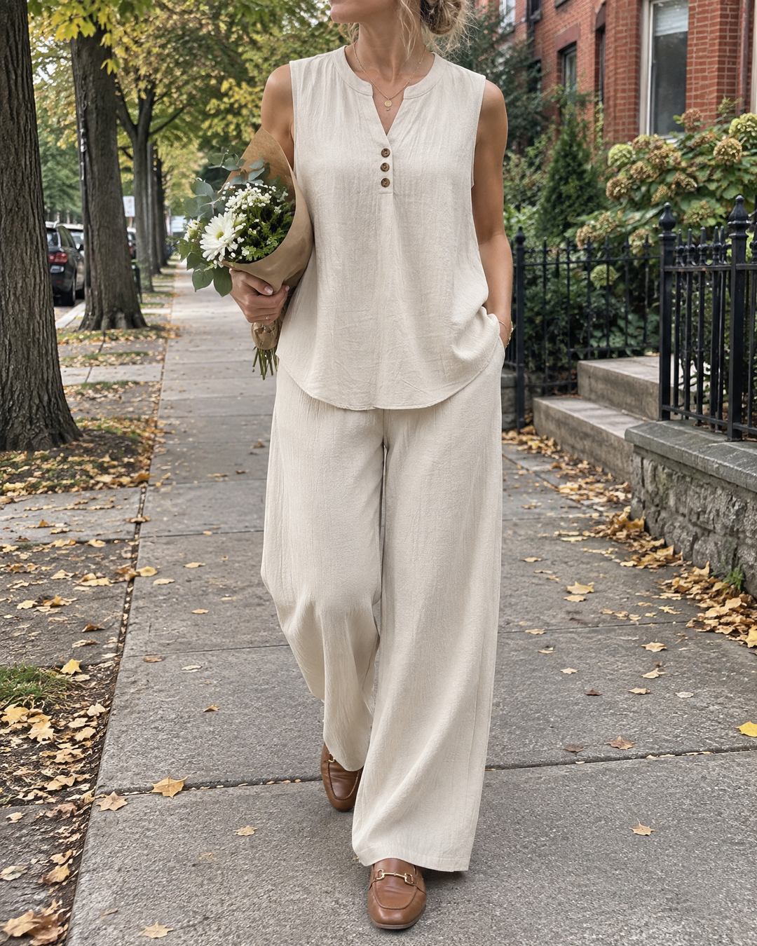 Marion - Sleeveless Top and Wide-Leg Set in beige, walking home on a grey autumn afternoon